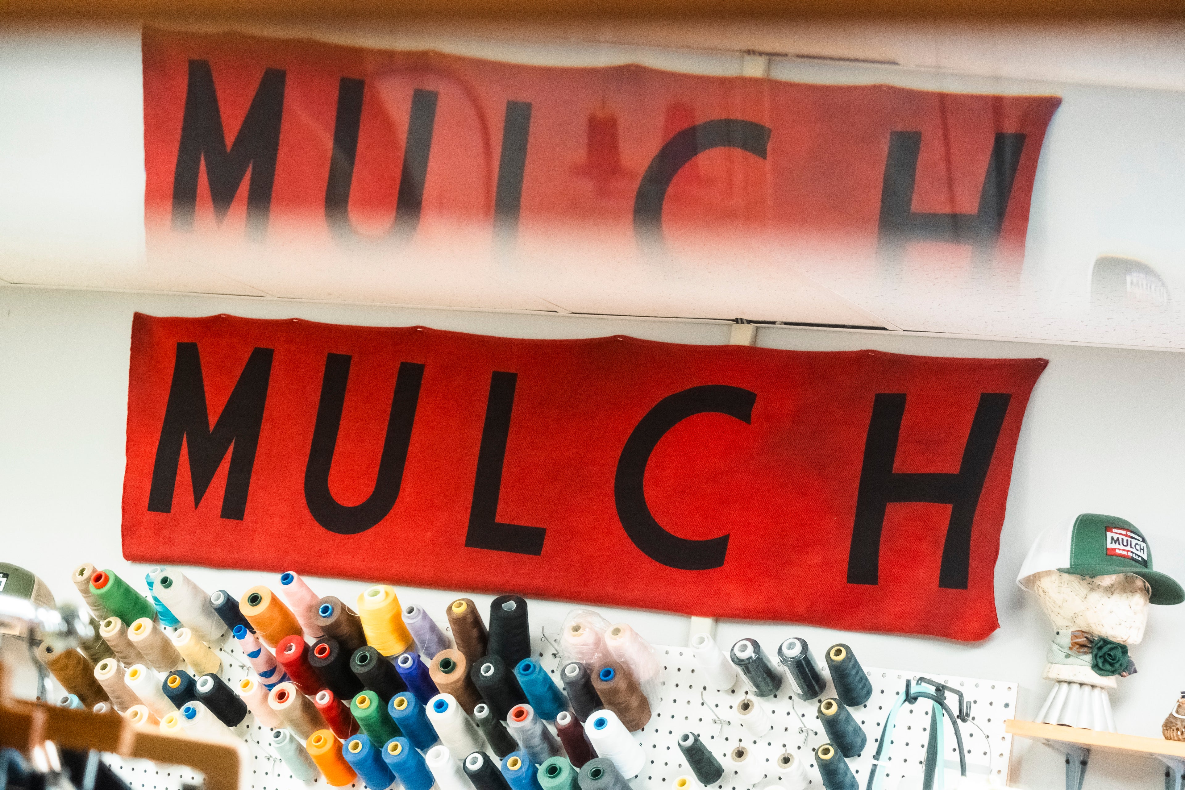 Mulch log over threads in our local atelier