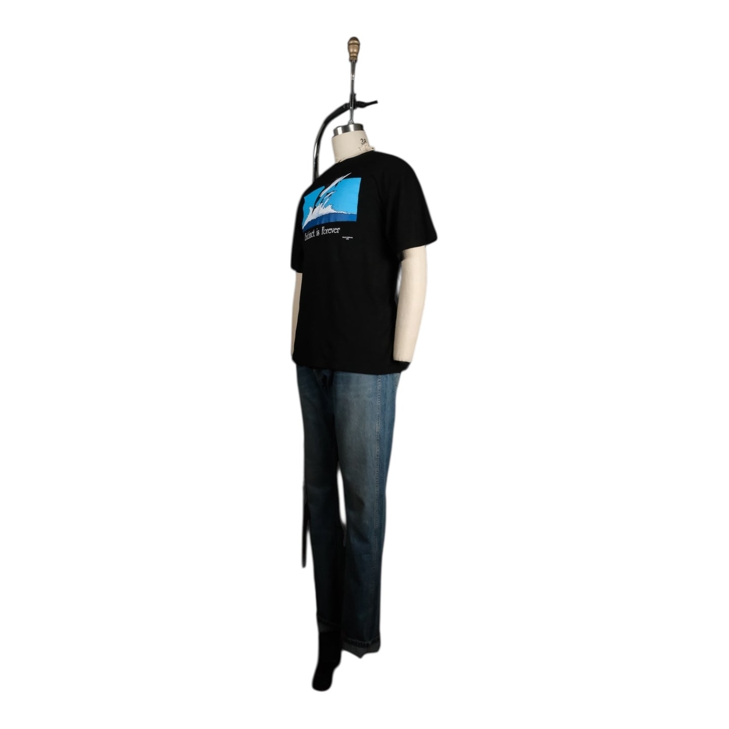 Black t-shirt with graphic design on a mannequin against a white background