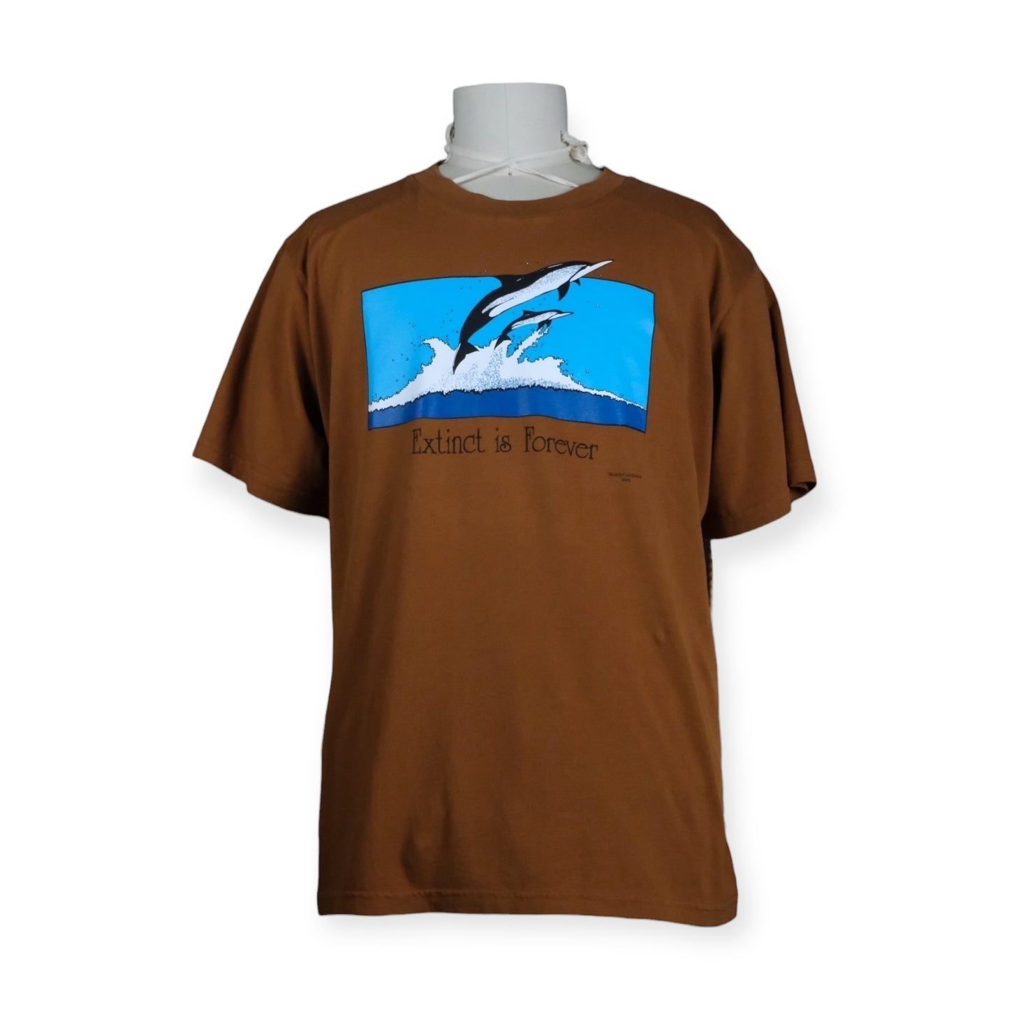 Brown t-shirt with a graphic of a dolphin and text on a white background
