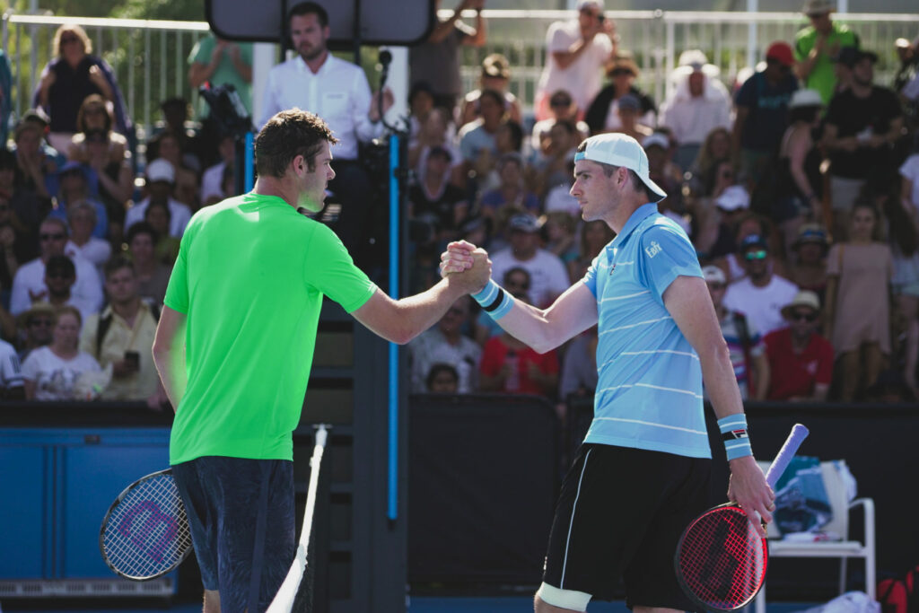 Reilly Opelka 7ft and Jon Isner 6ft 10" shake hands after 1st round matchup in Australian Open 2019